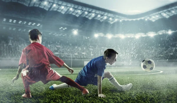 Barn spelar fotboll. Mixed media — Stockfoto