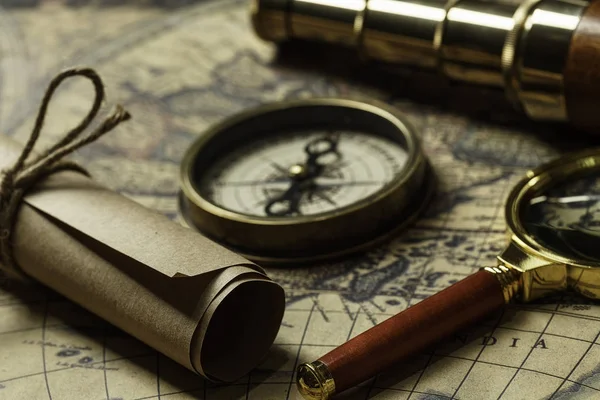 Retro compass with old map and spyglass — Stock Photo, Image