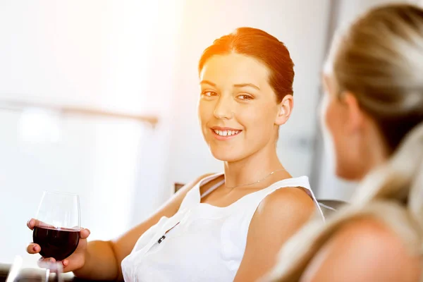 Female friends with glass of wine — Stock Photo, Image