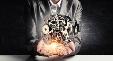 Dişli mekanizması elinde. Karışık teknik