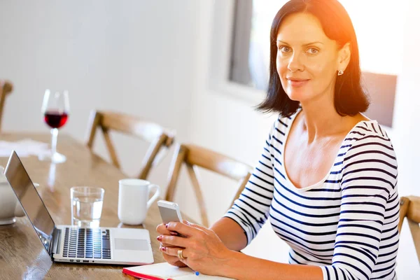 Portrait of attractive woman holding phone — Stock Photo, Image