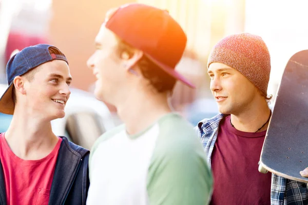 Teenagers walking down the street in summer day — Stock Photo, Image