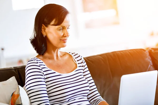 Beautiful woman working on her laptop — Stock Photo, Image