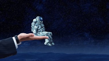 Spaceman erkek elinde. Karışık teknik