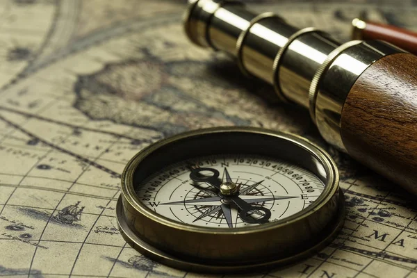 Retro compass with old map and spyglass Stock Photo