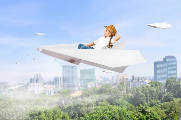Child dreaming to be pilot. Mixed media — Stock Photo, Image