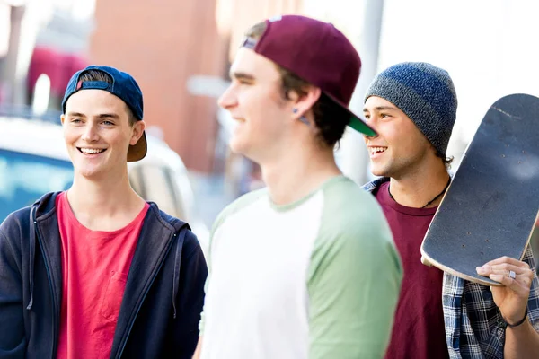 Teenagers walking down the street in summer day — Stock Photo, Image