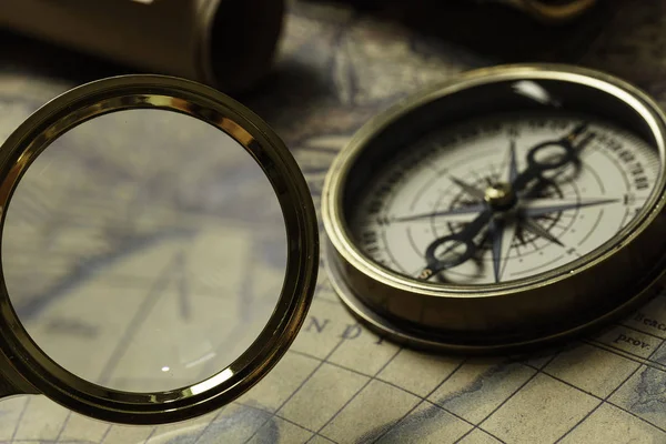 Retro compass with old map and spyglass — Stock Photo, Image