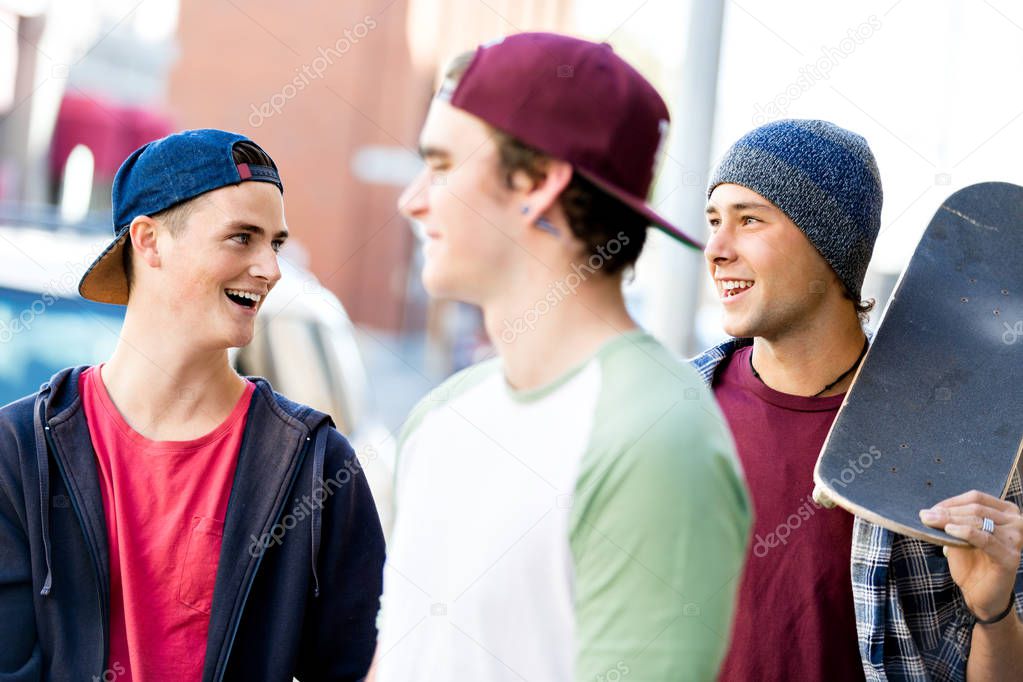 Teenagers walking down the street in summer day