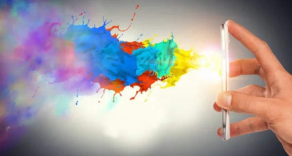 Smartphone with paint splash — Stock Photo, Image