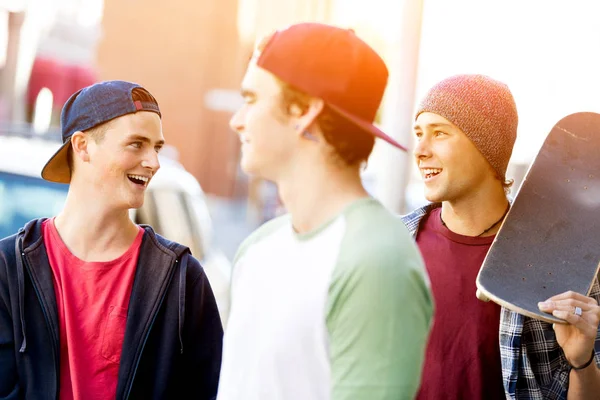 Teenagers walking down the street in summer day — Stock Photo, Image
