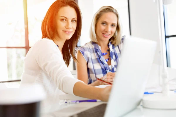 Image of two young business women in office — Stock Photo, Image