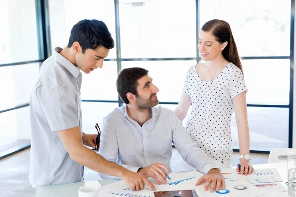 Group of happy young business people in a meeting — Stock Photo, Image
