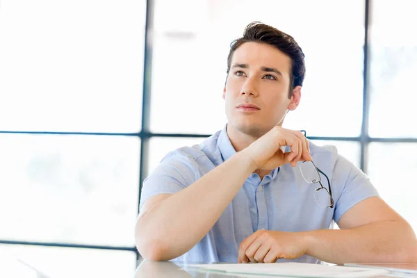 Pensive businessman at office — Stock Photo, Image