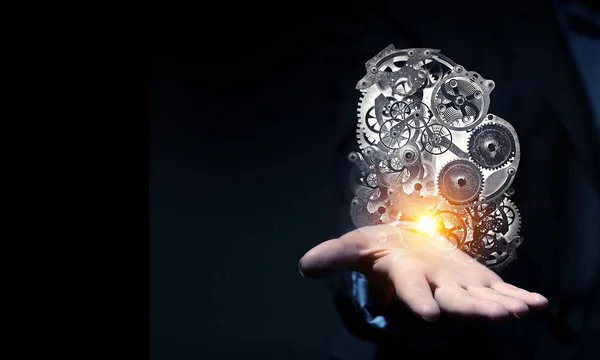 Μηχανισμός cogwheel στο χέρι. Μικτή τεχνική — Φωτογραφία Αρχείου