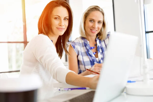 Image of two young business women in office — Stock Photo, Image