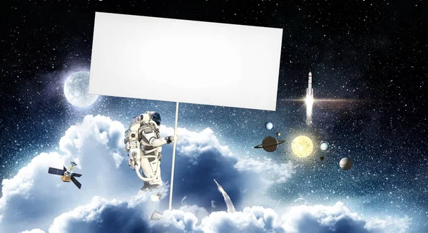 Spaceman met banner. Mixed media — Stockfoto