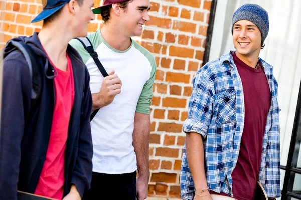 Teenage friends walking at the street — Stock Photo, Image