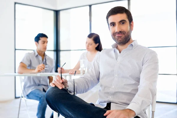 Young man in casual in office — Stock Photo, Image