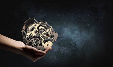 Dişli mekanizması elinde. Karışık teknik