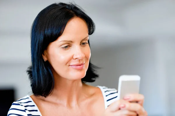 Portrait of attractive woman holding phone — Stock Photo, Image