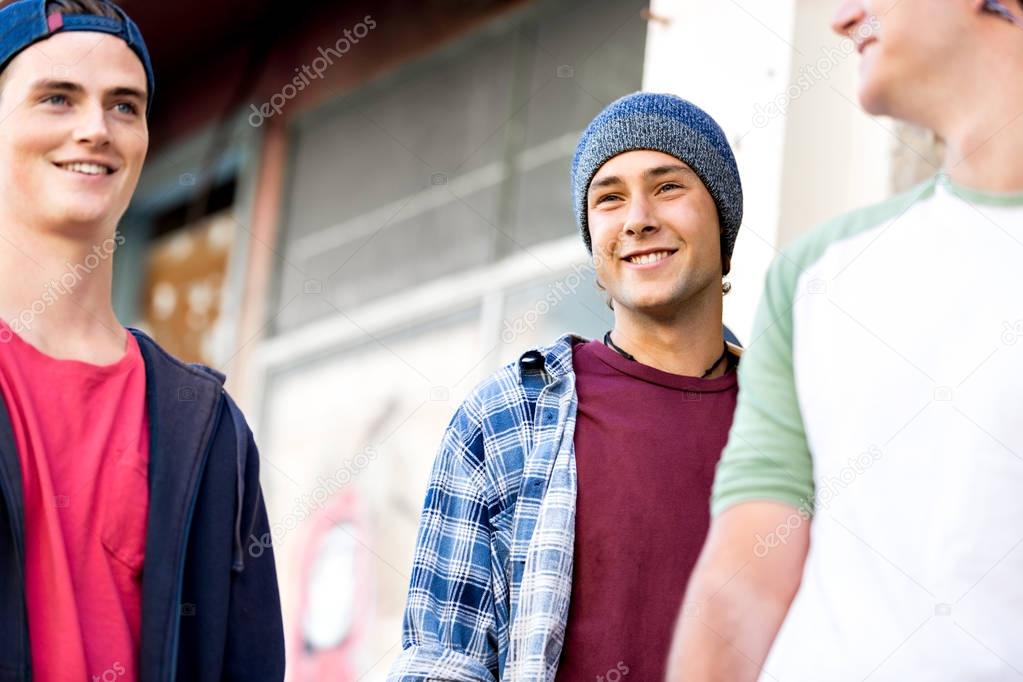 Teenage friends walking at the street