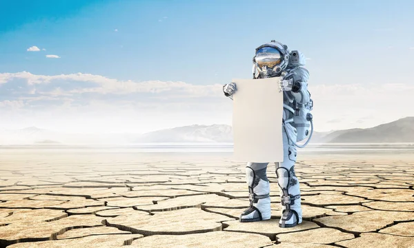 Spaceman met banner. Mixed media — Stockfoto