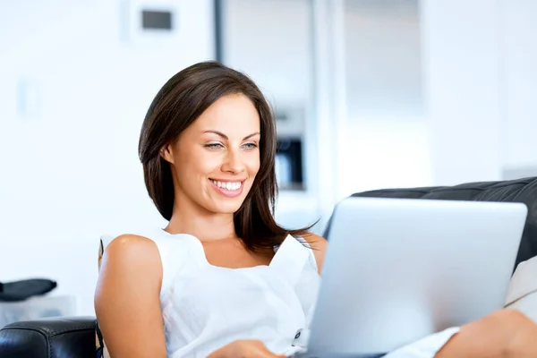 Young beautiful woman working on her laptop Stock Photo