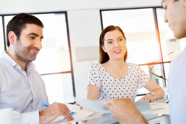 Group of happy young business people in a meeting Stock Photo