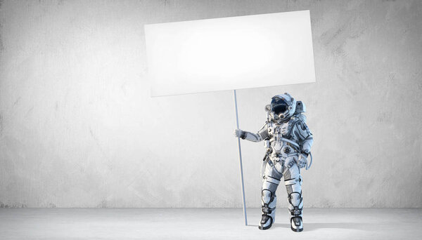 Spaceman with banner. Mixed media Stock Picture
