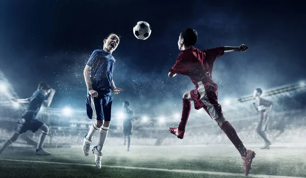 Barn spelar fotboll. Mixed media — Stockfoto