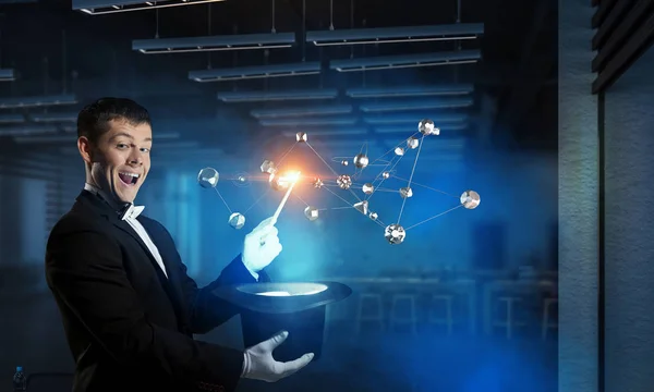 Businessman demonstrating magic . Mixed media — Stock Photo, Image