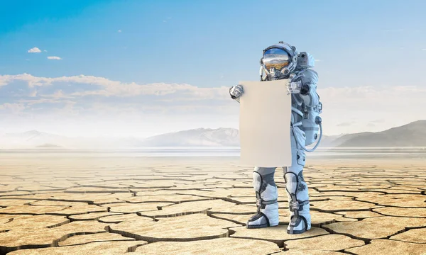 Spaceman met banner. Mixed media — Stockfoto