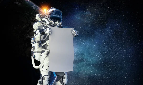 Hombre del espacio con pancarta. Medios mixtos —  Fotos de Stock