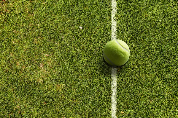 Tennis ball on the court — Stock Photo, Image