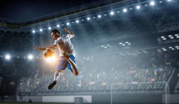 Soccer player at stadium. Mixed media — Stock Photo, Image