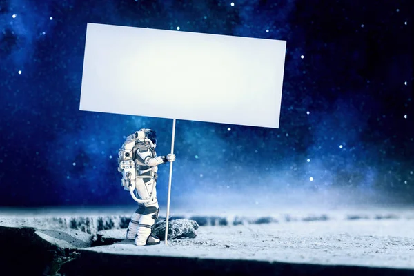 Hombre del espacio con pancarta. Medios mixtos Fotos de stock libres de derechos