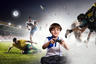 Bir video oyunu oynayan çocuk. Karışık teknik