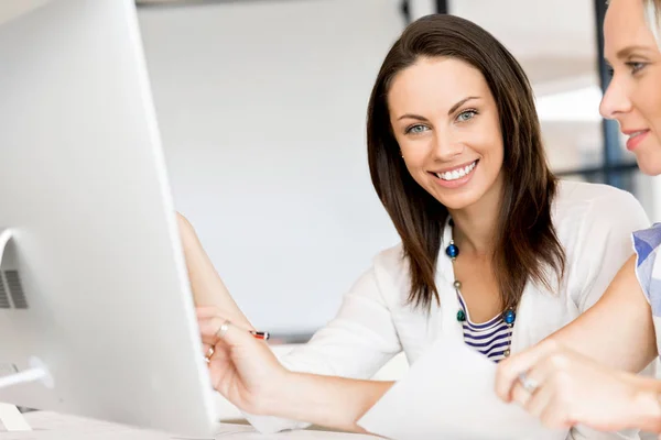 Image of two young business women in office — Stock Photo, Image