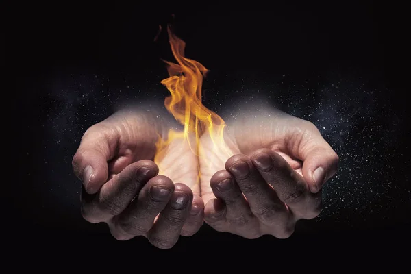 Fire burning in his hands — Stock Photo, Image