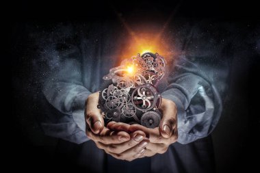 Dişli mekanizması elinde. Karışık teknik