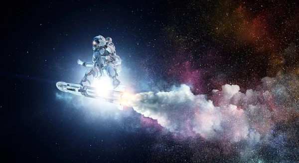 Spaceman på flygande styrelse. Mixed media — Stockfoto