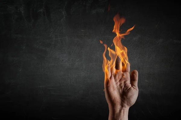 Fire burning in his hands — Stock Photo, Image