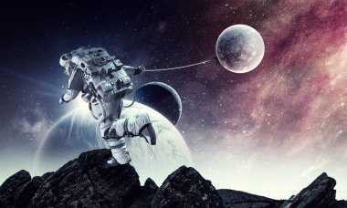 Fantezi görüntü uzay adamı yakalamak gezegen ile. Karışık teknik