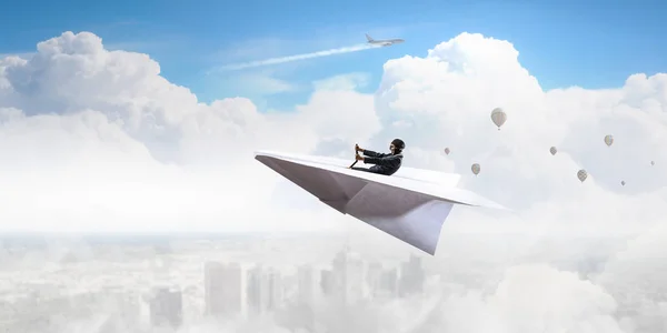 Woman pilot in paper plane. Mixed media — Stock Photo, Image