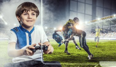 Bir video oyunu oynayan çocuk. Karışık teknik