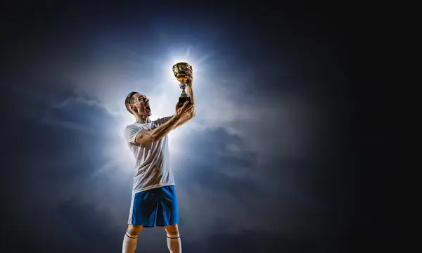 Fußballer im Stadion. Gemischte Medien — Stockfoto