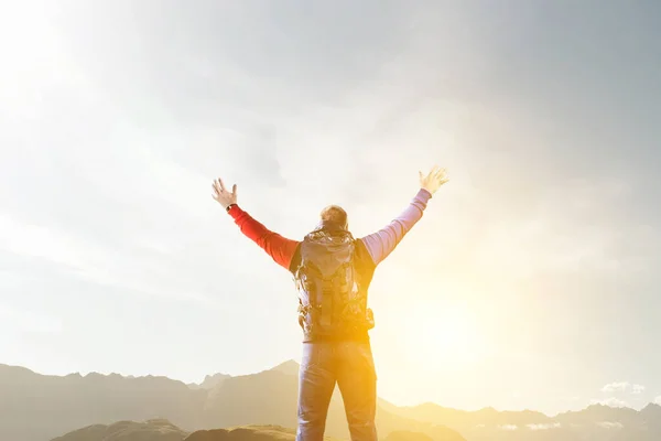 Hiker man in mountains. Mixed media — Stock Photo, Image