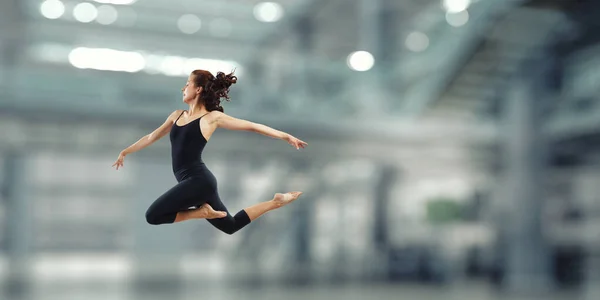 Gymnast girl in jump Смешанные медиа — стоковое фото