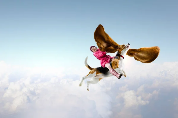 Super hero and her flying dog — Stock Photo, Image